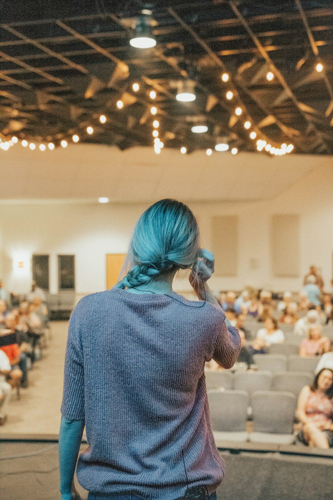 person giving speech on stage
