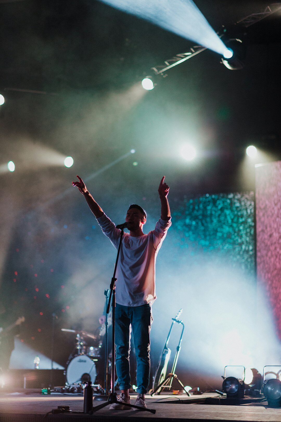 person achieving goal on stage